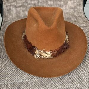 CHURCHILL rust colored cowboy hat. Feathers around the hat. Size 7 1/8.